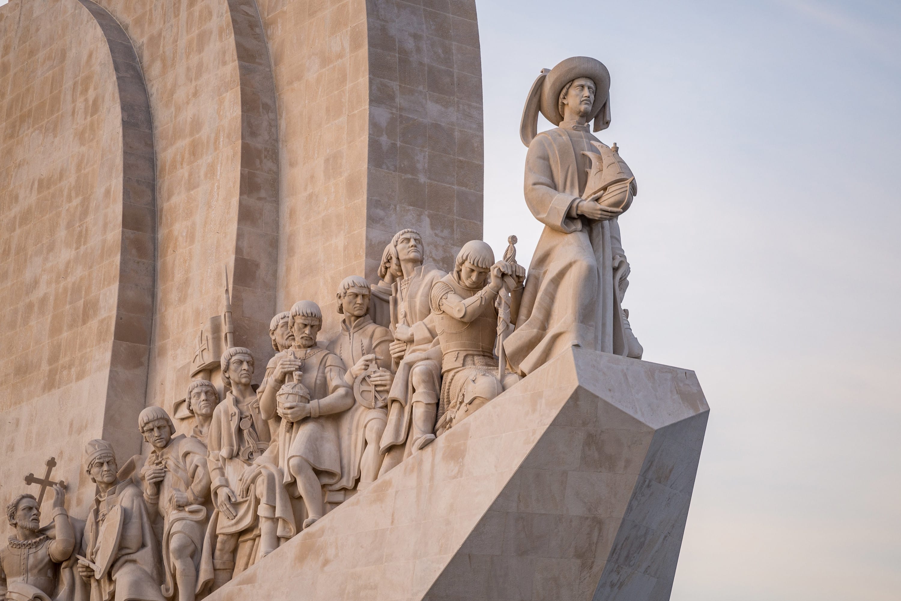 The statues on the Monument of Discoveries under the sunlight in Lisbon in Portugal
